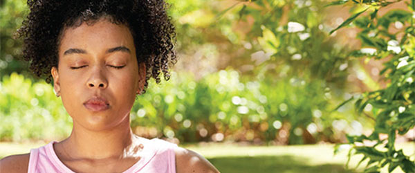 woman meditating outside